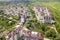 Top view of apartment or office tall buildings, parked cars, urban city landscape. Drone aerial photography