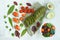 Top view of an appetizer of salmon with herbs, avocado and salad