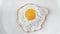 Top view appetizing fresh morning meal fried egg rotating shot isolated at white background