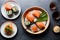 Top view of appetizing sliced salmon sashimi served on plate with sushi rolls and greenery placed