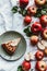 top view of arrangement of piece of apple pie on plate and fresh apples