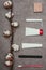 Top view of arrangement of various feminine hygiene supplies and cotton twig