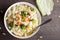 Top view of Asian Napa cabbage salad on wood