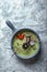 Top view asparagus soup with octopus in a gray bowl on a concrete marble gray background. Copy space, food photo