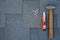 Top view on asphalt bitumen shingles on a roof with hammer,nails and stationery knife background