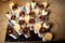 top view on assorted cream mousse dessert in small plastic cups