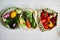 Top view assorted fresh vegetables in reusable cotton bags