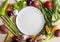 Top view assortment veggies with empty plate. High quality and resolution beautiful photo concept