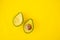 Top view avocado fruit healthy food on yellow background