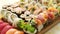 Top view background with set of colorful different kinds of sushi rolls placed on wooden board
