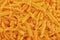 Top view on background texture of grated cheese.