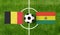 Top view ball with Belgium vs. Bolivia flags match on green football field