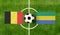 Top view ball with Belgium vs. Gabon flags match on green football field