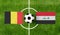 Top view ball with Belgium vs. Iraq flags match on green football field