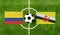 Top view ball with Colombia vs. Brunei flags match on green football field