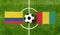 Top view ball with Colombia vs. Guinea flags match on green football field