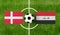 Top view ball with Denmark vs. Iraq flags match on green football field
