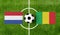 Top view ball with Netherlands vs. Mali flags match on green football field