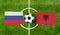 Top view ball with Russia vs. Albania flags match on green soccer field