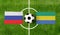 Top view ball with Russia vs. Gabon flags match on green soccer field