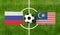 Top view ball with Russia vs. Malaysia flags match on green soccer field