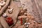 Top view of a bank of hot red peppers, spicy garlic, quail eggs and rosemary on a crumpled paper and wooden background.