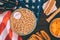 top view of baseball ball on plate with peanuts, baseball bat, glove, hot dog and beer bottles