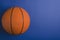 Top view of basketball on the blue surface.Empty space for text