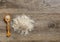 Top view of Basmati Rice pile with wooden spoon on the antique wooden background