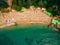 Top View of Beach. Aerial view of sandy beach with tourists swim