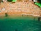 Top View of Beach. Aerial view of sandy beach with tourists swim