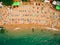 Top View of Beach. Aerial view of sandy beach with tourists swim