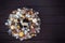 Top view Beautiful hand made golden Christmas wreath decorated with pine cones, ornamentals, spruce branches, balls, stars and