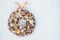 Top view Beautiful hand made golden Christmas wreath decorated with pine cones, ornamentals, spruce branches, balls, stars and
