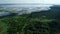 Top view Beautiful lake or pond in the middle of a green plant forest. Concept of environmental disaster and habitat destruction.