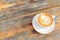 Top-View of a Beautiful Latte on a Wooden Table Outdoors