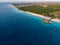 Top View on Beautiful thatch stilt house restaurant at Zanzibar Kendwa beach at evening time in Blue Water of Indian