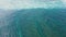 Top view of beautiful tropical beach seamless loop footage. Amazing Sandy coastline with white turquiose sea waves