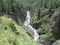 Top view of beautiful waterfall on the river Chubaty in its upper reaches on the way to the eponymous pass in Buryatia