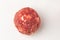 Top view on a beef meatball on white background