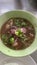 Top view beef noodle soup with fresh vegetables Asian food Thai food.