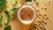 Top view of beer with foam and salty peanuts and on wooden table