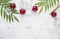 Top view berry cherries and ice cube on a gray concrete background. Summer frash concept