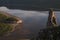 Top view of a big river and a floating vessel.