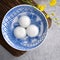 Top view of big tangyuan yuanxiao in a bowl on gray background for lunar new year food