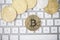 Top view on BitCoin, Ethereum and LiteCoin coins on keyboard as