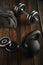 Top view of black iron kettlebell, dumbbell and grey towel on wooden floor Sport background with copyspace