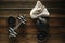 Top view of black iron kettlebell, dumbbell and white towel on w