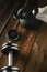 Top view of black iron kettlebell, dumbbell and white towel on w