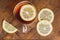 Top view of black tea with lemon in cup and on wooden plank table